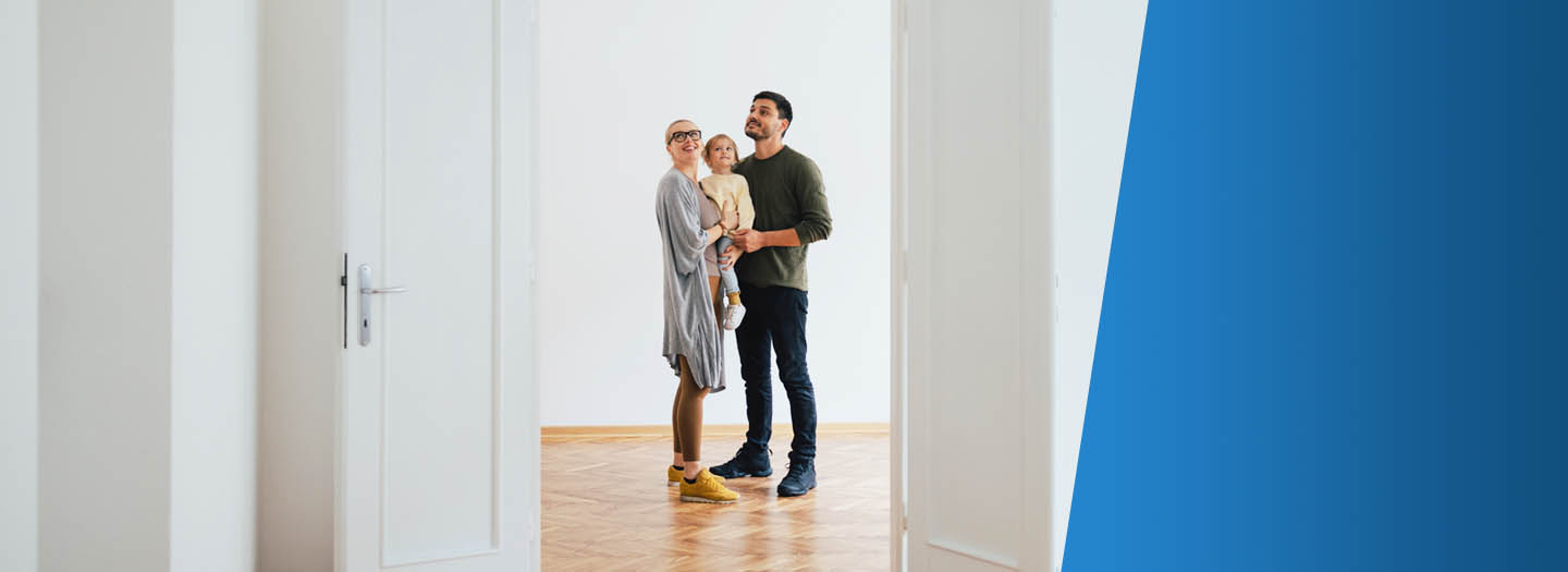 family standing in doorway of home